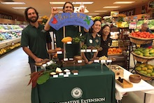 Alyssa Cho (third from left) and her graduate students Colin Hart and Russell Galanti, along with Joanne Imamura (all TPSS), demonstrated how cacao and macadamia nuts are processed from raw fruit/nut